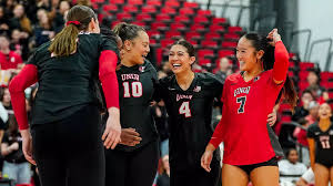Volleyball setter delivering a quick set to a middle blocker